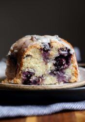 Sour Cream Blueberry Bundt Cake sliced on a plate