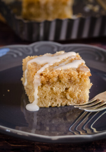 A slice of banana crumb cake with icing