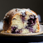 Sour Cream Blueberry Bundt Cake sliced on a plate