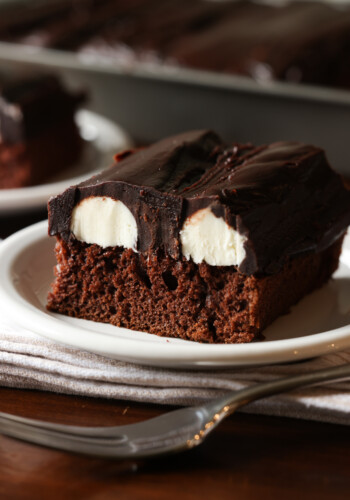 A slice of Bumpy Cake on a white plate