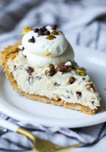 Slice of cannoli cheesecake on a plate