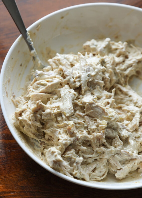 creamy chicken enchilada filling in a white bowl