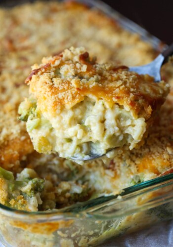 Scoop of Broccoli Rice Casserole baked in a 9x13 baking pan.