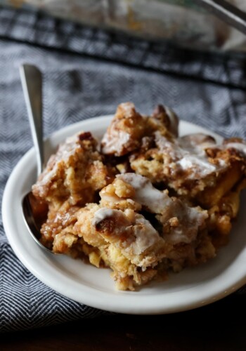 a piece of Cinnamon Roll Dump Cake on a plate with a fork