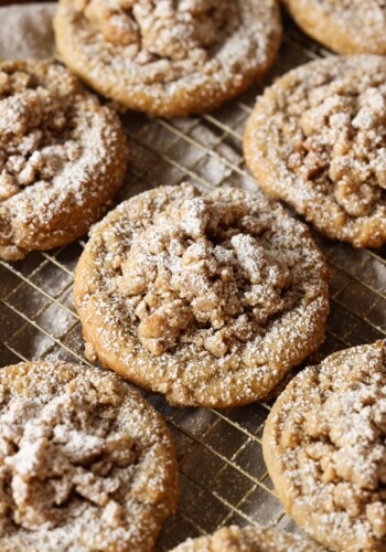 Coffee Cake Cookies on a cooling rack sprinkled with powdered sugar