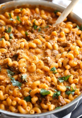 Creamy Italian sausage pasta in a skillet.