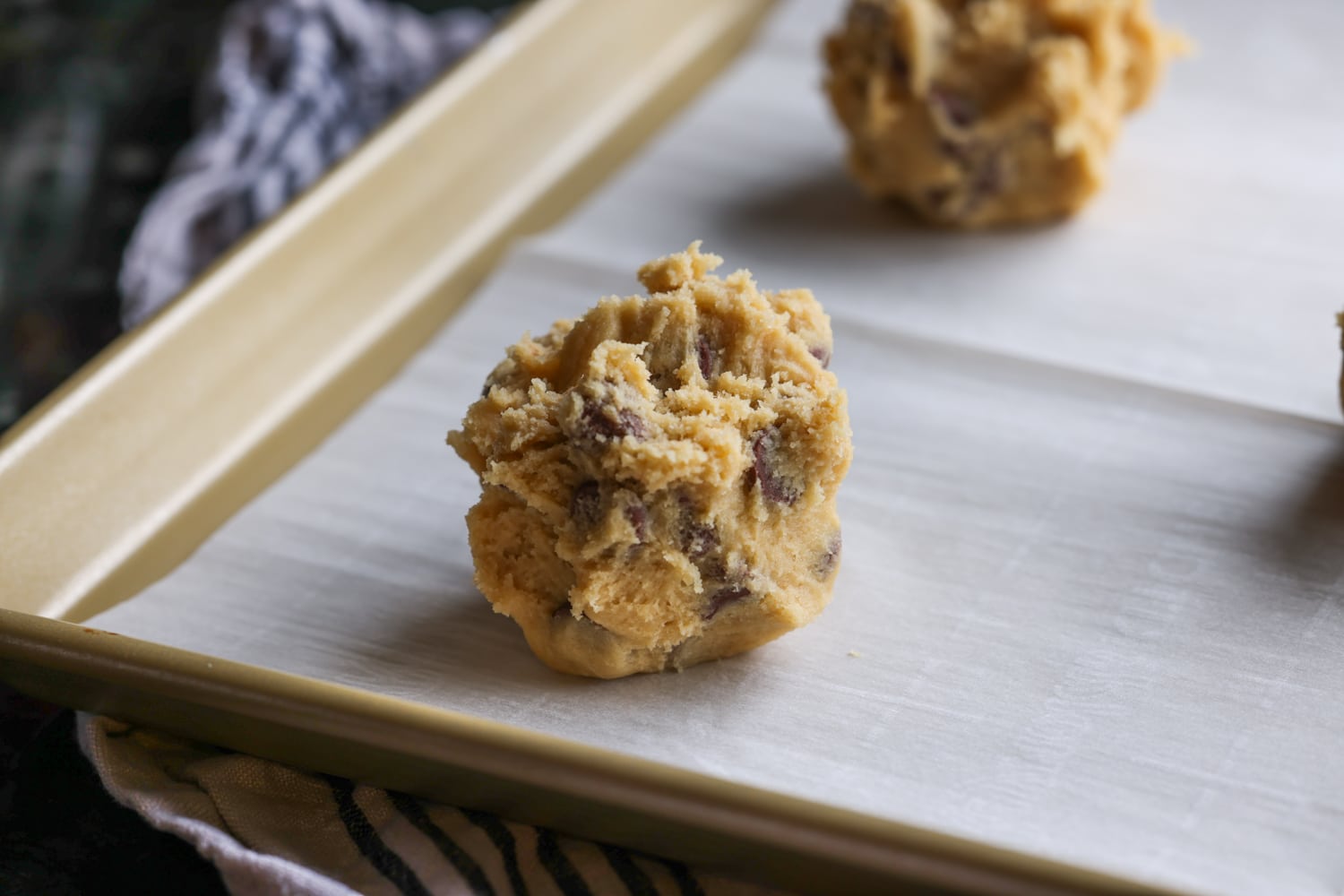 Cookie dough scoop on a baking sheet