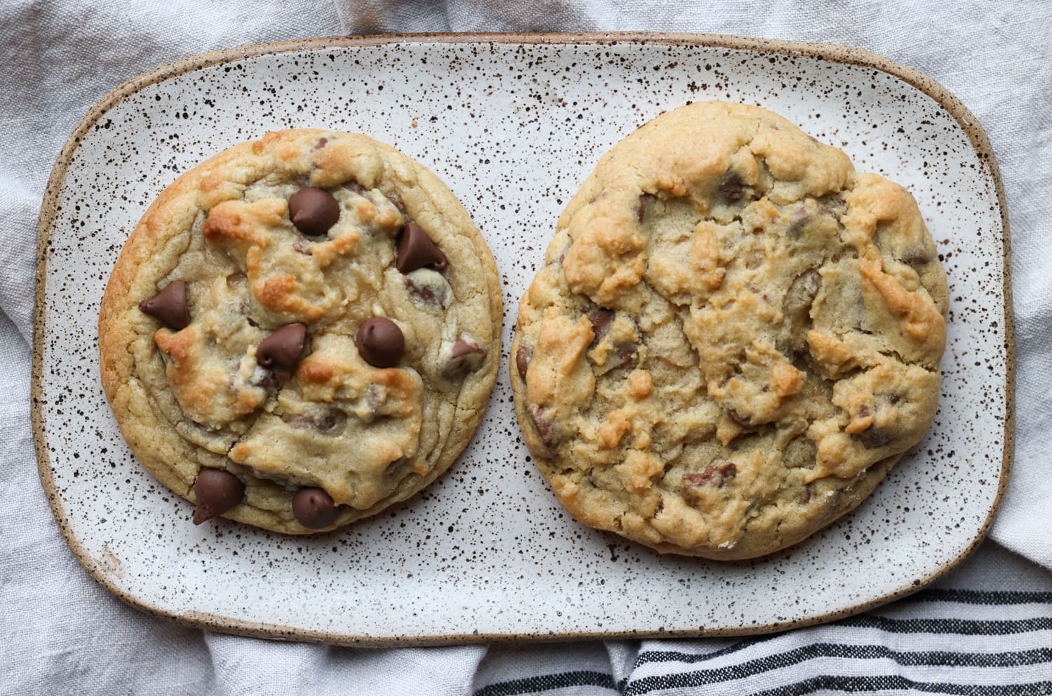 A side by side comparison of a homemade crumbl cooke next to a bakery crumbl cookie on a plate