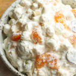 frog eye salad in a bowl with mandarin oranges