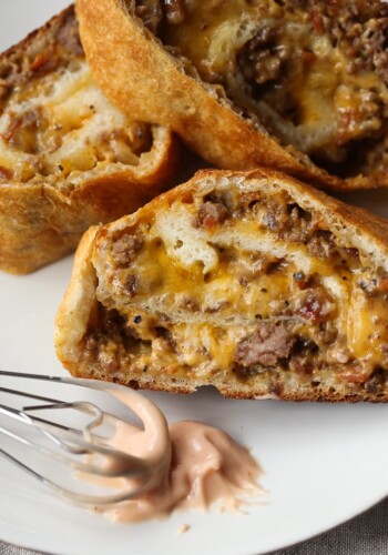 GARBAGE BREAD!! This is a simple recipe that can be adapted SO many ways! Bacon Cheeseburger Garbage Bread is our favorite, but throw your leftovers in a pizza crust and roll it up! The possibilities are endless.