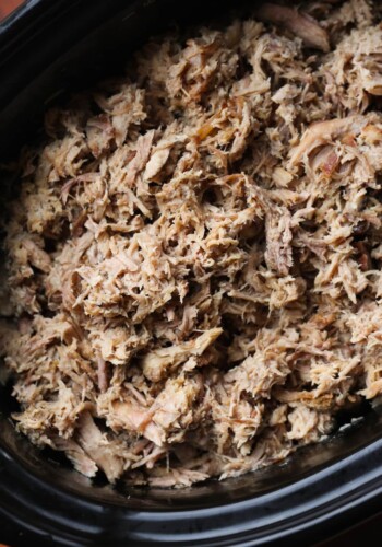 Shredded pulled Kalua pork in a crock pot.