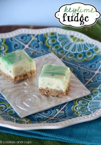 Two key lime fudge bars on a square white plate.