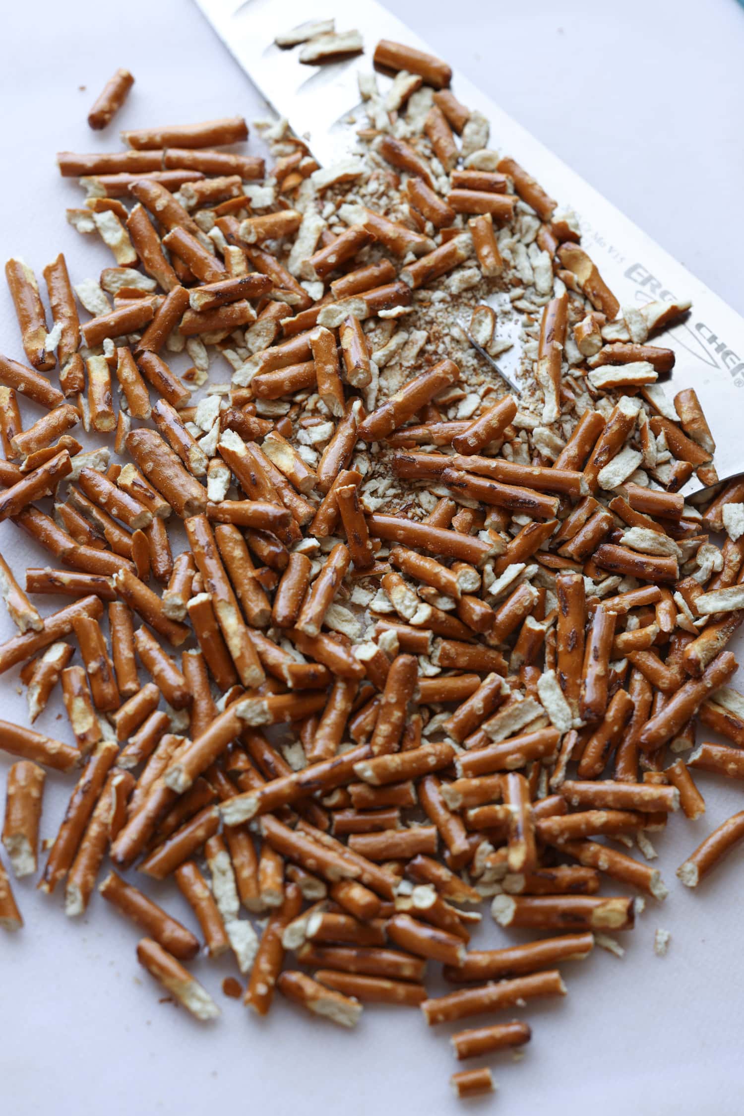 chopped pretzels sticks on a cutting board