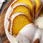 Glazed Mountain Dew bundt cake cut into slices on a plate.