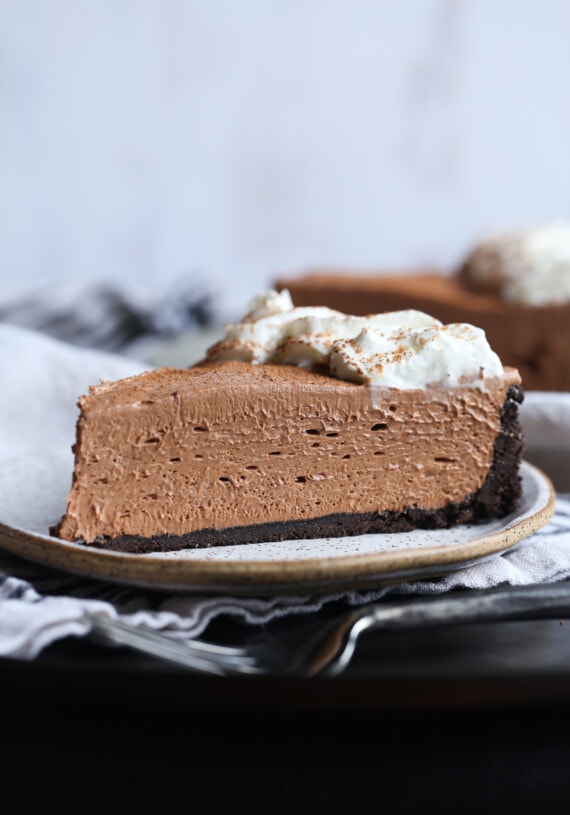 No bake cheesecake with Oreo crust on a plate.