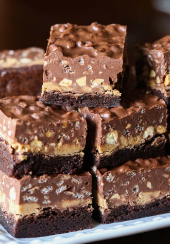 Peanut Butter Cup Crack Brownies stacked on a plate