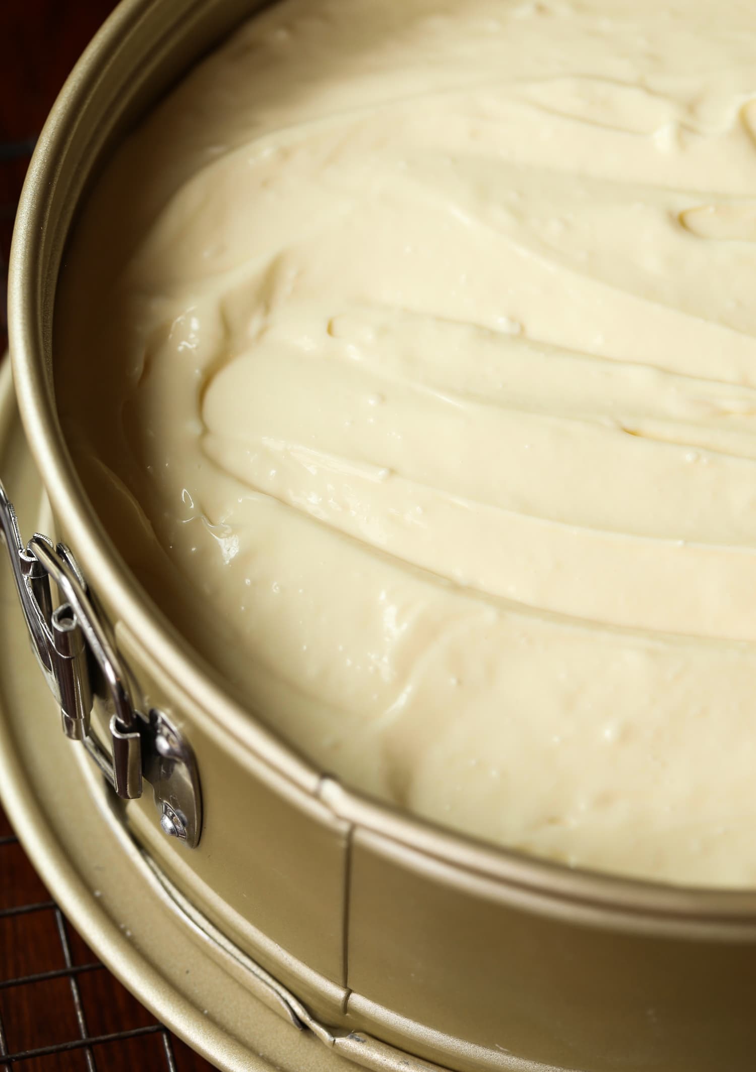 Homemade cheesecake in a springform pan ready to be baked.