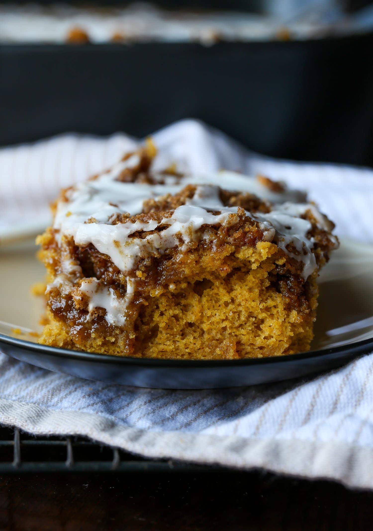 A slice of Pumpkin Cinnamon Roll Cake on a plate