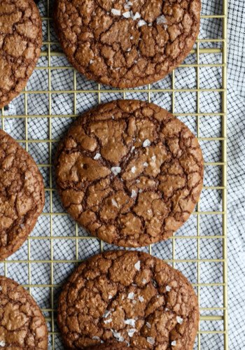 Salted crinkle cookies on a wire rack.