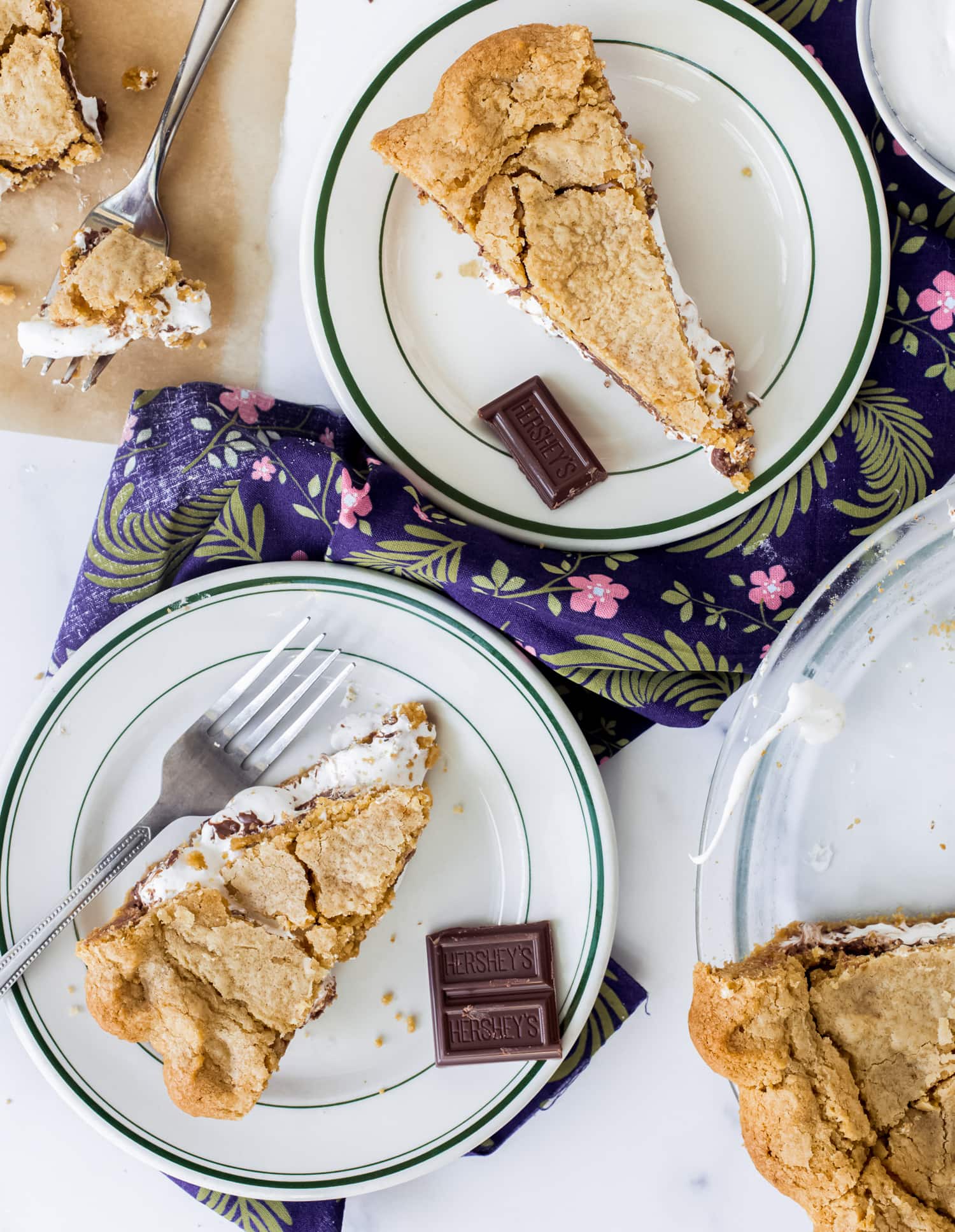 slices of s'mores pie on plates shot from above