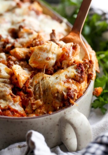 Unstuffed Shells pasta casserole with a spoon and melty cheese