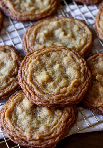 pan banging walnut cookies on a wire rack